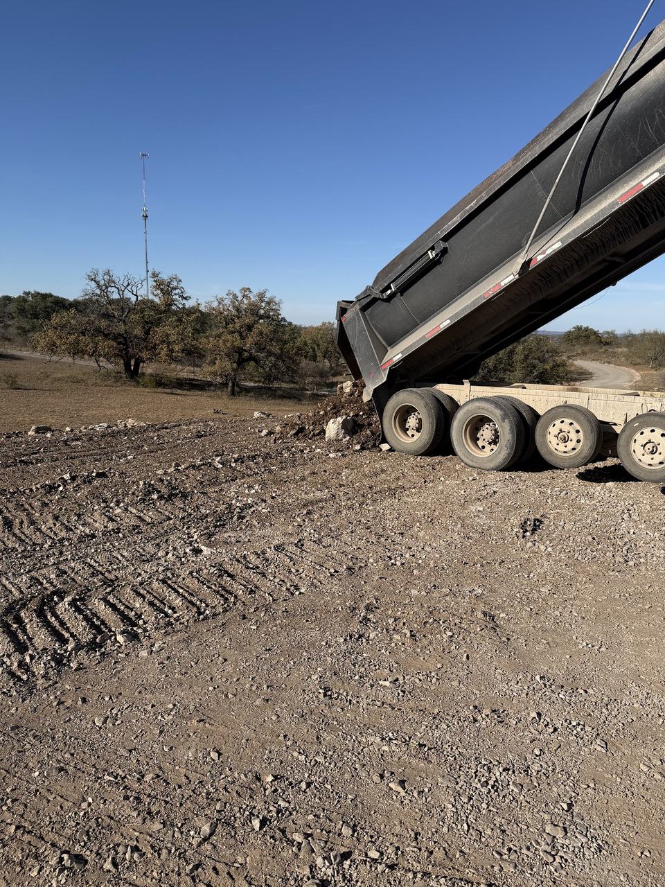 Hauling fill for the range. December 2025.